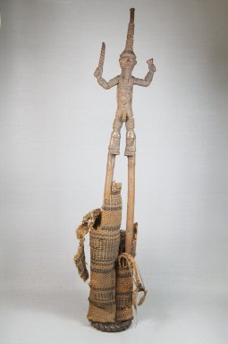 Duahn Yibay (Dan, flourished 1920s–1930s). <em>Figure of a Male Stilt Dancer Holding Knife and Horn</em>, late 19th or early 20th century. Copper alloy, fiber, 24 1/4 x 4 3/4 x 3in. (61.6 x 12.1 x 7.6cm). Brooklyn Museum, Museum Expedition 1922, Robert B. Woodward Memorial Fund, 22.272. Creative Commons-BY (Photo: Brooklyn Museum, CUR.22.272_front_PS5.jpg)