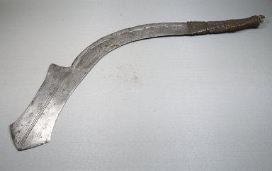 Ngbandi. <em>Executioner's Sword, Engraved</em>, 19th century. Iron, leather, metal wire, nailheads, 3 1/4 x 24 in. (8.3 x 61 cm). Brooklyn Museum, Museum Expedition 1922, Robert B. Woodward Memorial Fund, 22.438. Creative Commons-BY (Photo: Brooklyn Museum, CUR.22.438_threequarter_PS5.jpg)