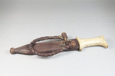  <em>Knife with Scabbard</em>, 19th century. Iron, bone, leather, 1 7/8 x 9 13/16 in. (4.7 x 25 cm). Brooklyn Museum, Museum Expedition 1922, Robert B. Woodward Memorial Fund, 22.446a-b. Creative Commons-BY (Photo: Brooklyn Museum, CUR.22.446a-b_assembled_PS5.jpg)
