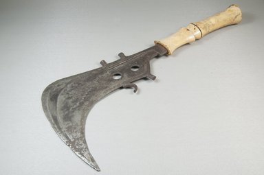 Mangbetu. <em>Knife, Ivory Handle (Trumbash)</em>, late 19th century. Iron, ivory, 6 7/8 x 15 1/4 in. (17.5 x 38.7 cm). Brooklyn Museum, Museum Expedition 1922, Robert B. Woodward Memorial Fund, 22.457. Creative Commons-BY (Photo: Brooklyn Museum, CUR.22.457_threequarter_PS5.jpg)