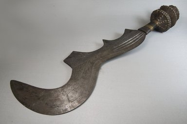 Ngala. <em>Executioner's Sword, Engraved</em>, 19th-20th century. Iron, wood, wire, 5 7/8 x 26 3/8 in. (15 x 67 cm). Brooklyn Museum, Museum Expedition 1922, Robert B. Woodward Memorial Fund, 22.459. Creative Commons-BY (Photo: Brooklyn Museum, CUR.22.459_side_PS5.jpg)