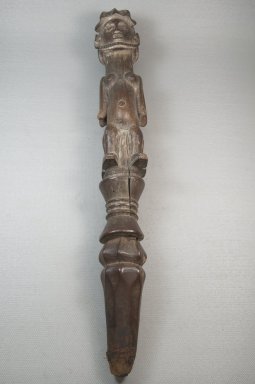 Woyo. <em>Staff-Rattle (Ntafu Maluangu)</em>, 19th century. Wood, pigment, ferrous screw, 18 3/4 x 2 7/8 x 2 1/4in. (47.6 x 7.3 x 5.7cm). Brooklyn Museum, Museum Expedition 1922, Robert B. Woodward Memorial Fund, 22.476. Creative Commons-BY (Photo: Brooklyn Museum, CUR.22.476_front_PS5.jpg)