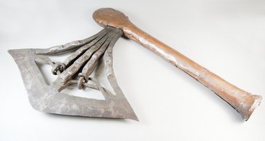 Songye. <em>Axe</em>, late 19th or early 20th century. Iron, wood, 18 7/8 x 13 x 1 15/16 in. (48 x 33 x 5 cm). Brooklyn Museum, Museum Expedition 1922, Robert B. Woodward Memorial Fund, 22.524. Creative Commons-BY (Photo: Brooklyn Museum, CUR.22.524_threequarter_PS5.jpg)