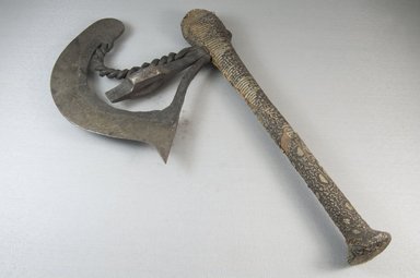 Songye. <em>Axe</em>, late 19th or early 20th century. Iron, wood, reptile skin, 12 7/8 x 7 7/8 x 1 in. (32.7 x 20 x 2.5 cm). Brooklyn Museum, Museum Expedition 1922, Robert B. Woodward Memorial Fund, 22.530. Creative Commons-BY (Photo: Brooklyn Museum, CUR.22.530_top_PS5.jpg)