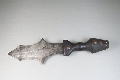 Kuba (Nkutshu subgroup). <em>Dagger</em>, late 19th-early 20th century. Iron, wood, nailheads, 3 1/8 x 11 in. (8 x 28 cm). Brooklyn Museum, Museum Expedition 1922, Robert B. Woodward Memorial Fund, 22.570. Creative Commons-BY (Photo: Brooklyn Museum, CUR.22.570_side_PS5.jpg)