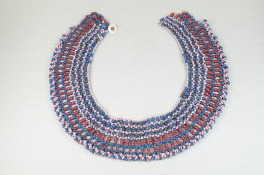 Xhosa (Thembu subgroup). <em>Collar (Ingqosha)</em>, early 20th century. Glass beads, natural fiber, button, 20 3/4 x 2 in. (52.7 x 5.1 cm). Brooklyn Museum, Gift of Thomas A. Eddy, 22.592. Creative Commons-BY (Photo: Brooklyn Museum, CUR.22.592_front_PS5.jpg)