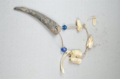  <em>Wristlet</em>, early 20th century. Teeth, glass beads, 10 7/16 in. (26.5 cm). Brooklyn Museum, Museum Expedition 1922, Robert B. Woodward Memorial Fund, 22.593. Creative Commons-BY (Photo: Brooklyn Museum, CUR.22.593_front_PS5.jpg)