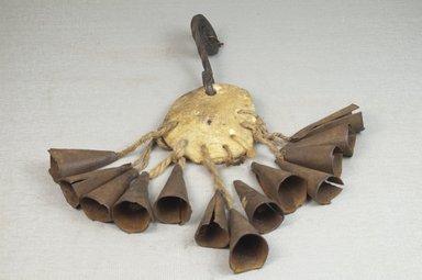  <em>Anklet with Ornament and Bells</em>, before 1922. Rawhide, iron, fiber, 6 x 7 in. (15.2 x 17.8 cm). Brooklyn Museum, Museum Expedition 1922, Robert B. Woodward Memorial Fund, 22.655. Creative Commons-BY (Photo: Brooklyn Museum, CUR.22.655_front_PS5.jpg)