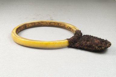  <em>Bracelet, Ornament</em>. Ivory, fiber Brooklyn Museum, Museum Expedition 1922, Robert B. Woodward Memorial Fund, 22.667a-b. Creative Commons-BY (Photo: Brooklyn Museum, CUR.22.667a-b_front_PS5.jpg)