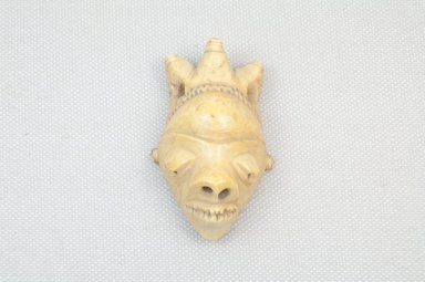 Pende (Central). <em>Pendant Mask (Ghikhokho) with Chieftain's Headdress</em>, 19th century. Ivory, 2 1/4 x 1 1/2 x 1 in. (6.0 x 3.5 x 2.5 cm). Brooklyn Museum, Museum Expedition 1922, Robert B. Woodward Memorial Fund, 22.670. Creative Commons-BY (Photo: Brooklyn Museum, CUR.22.670_front_PS5.jpg)