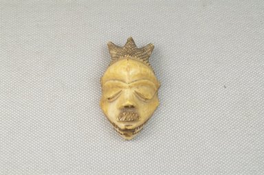 Pende. <em>Head</em>. Engraved ivory Brooklyn Museum, Museum Expedition 1922, Robert B. Woodward Memorial Fund, 22.671. Creative Commons-BY (Photo: Brooklyn Museum, CUR.22.671_front_PS5.jpg)