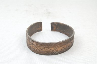  <em>Bracelet</em>. Engraved brass Brooklyn Museum, Museum Expedition 1922, Robert B. Woodward Memorial Fund, 22.724. Creative Commons-BY (Photo: Brooklyn Museum, CUR.22.724_front_PS5.jpg)