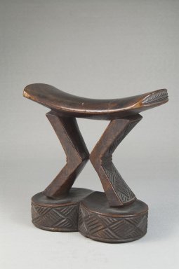 Kuba. <em>Headrest</em>, late 19th or early 20th century. Wood, 5 5/16 x 5 5/16 x 2 1/2 in. (13.5 x 13.5 x 6.4 cm). Brooklyn Museum, Museum Expedition 1922, Robert B. Woodward Memorial Fund, 22.732. Creative Commons-BY (Photo: Brooklyn Museum, CUR.22.732_threequarter_PS5.jpg)