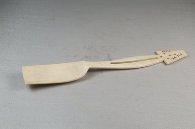  <em>Spoon, five perforations in the handle</em>, late 19th-early 20th century. Ivory, 1 5/16 x 9 5/8 in. (3.3 x 24.4 cm). Brooklyn Museum, Museum Expedition 1922, Robert B. Woodward Memorial Fund, 22.744. Creative Commons-BY (Photo: Brooklyn Museum, CUR.22.744_side_PS5.jpg)