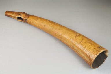  <em>Horn</em>, before 1922. Plain ivory, palm fiber, 2 1/4 x 13 3/8 in. (5.7 x 34 cm). Brooklyn Museum, Museum Expedition 1922, Robert B. Woodward Memorial Fund, 22.788. Creative Commons-BY (Photo: Brooklyn Museum, CUR.22.788_threequarter_PS5.jpg)