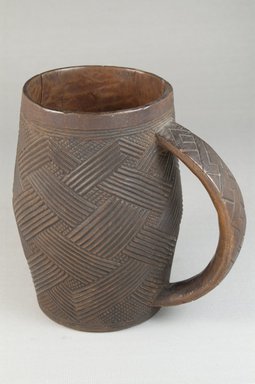 Kuba (Bushoong subgroup). <em>Cup</em>, early 20th century. Wood, height: 5 5/16 in. (13.5 cm); diameter: 3 1/16 in. (7.8 cm). Brooklyn Museum, Museum Expedition 1922, Robert B. Woodward Memorial Fund, 22.799. Creative Commons-BY (Photo: Brooklyn Museum, CUR.22.799_front_PS5.jpg)