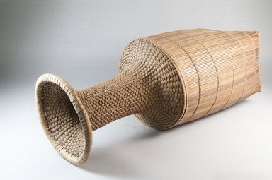  <em>Cassava Sifter</em>, early 20th century. Vegetal fiber, cane, raffia, reed, 17 3/4 x 4 7/8 in. (45.0 x 12.5 cm). Brooklyn Museum, Museum Expedition 1922, Robert B. Woodward Memorial Fund, 22.832. Creative Commons-BY (Photo: Brooklyn Museum, CUR.22.832_threequarter_PS5.jpg)