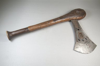 Songye. <em>Axe</em>, late 19th or early 20th century. Iron, copper alloy, wood, 16 1/8 x 9 1/4 x 1 1/4in. (41 x 23.5 x 3.2cm). Brooklyn Museum, Brooklyn Museum Collection, 22.840. Creative Commons-BY (Photo: Brooklyn Museum, CUR.22.840_threequarter_PS5.jpg)