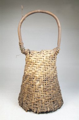  <em>Basket Rattle with Hoop Handle-Dance Rattle</em>, late 19th or early 20th century. Rattan, calabash, 11 1/2 x 5 3/4 in. (31.8 x 14.6 cm). Brooklyn Museum, Museum Expedition 1922, Robert B. Woodward Memorial Fund, 22.844. Creative Commons-BY (Photo: Brooklyn Museum, CUR.22.844_front_PS5.jpg)