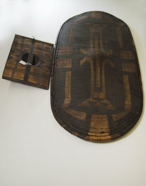 Zande. <em>Shield</em>, late 19th century. Fiber, wood., 43 11/16 x 20 1/16 in. (111 x 51 cm). Brooklyn Museum, Museum Expedition 1922, Robert B. Woodward Memorial Fund, 22.857. Creative Commons-BY (Photo: Brooklyn Museum, CUR.22.857_with_handle_PS5.jpg)