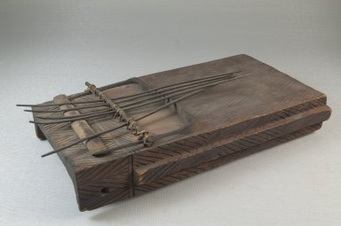  <em>Plucked Idiophone (Sanza)</em>, late 19th or early 20th century. Engraved wood, metal, 2 1/2 x 9 x 5 in. (6.4 x 22.9 x 12.7 cm). Brooklyn Museum, Museum Expedition 1922, Robert B. Woodward Memorial Fund, 22.891. Creative Commons-BY (Photo: Brooklyn Museum, CUR.22.891_threequarter_PS5.jpg)