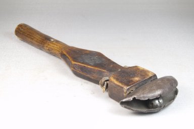 <em>Bell with Long Handle</em>, late 19th or early 20th century. Iron, wood, 10 x 3 in. (25.5 x 7.4 cm). Brooklyn Museum, Museum Expedition 1922, Robert B. Woodward Memorial Fund, 22.899. Creative Commons-BY (Photo: Brooklyn Museum, CUR.22.899_threequarter_PS5.jpg)