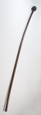  <em>Cane, Knob at Handle</em>. Light wood, 37 13/16 x 1 15/16 in. (96 x 5 cm). Brooklyn Museum, Gift of Thomas A. Eddy, 22.947. Creative Commons-BY (Photo: Brooklyn Museum, CUR.22.947_threequarter_PS5.jpg)