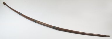  <em>Long Bow, Knob on One End</em>. Wood, 39 3/8 x 9/16 in. (100 x 1.5 cm). Brooklyn Museum, Museum Expedition 1922, Robert B. Woodward Memorial Fund, 22.957. Creative Commons-BY (Photo: Brooklyn Museum, CUR.22.957_threequarter_PS5.jpg)