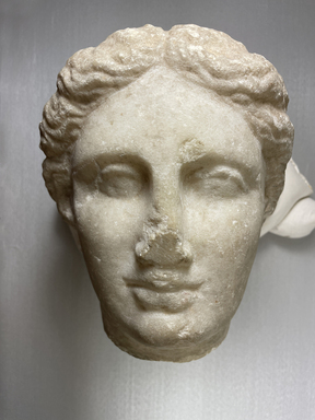 Greek. <em>Head of a Woman</em>, 4th century B.C.E. Marble, 8 7/8 × 7 7/8 × 8 1/16 in. (22.5 × 20 × 20.5 cm). Brooklyn Museum, Robert B. Woodward Memorial Fund, 24.434. Creative Commons-BY (Photo: Brooklyn Museum, CUR.24.434_view01.jpg)