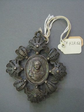  <em>Filigree Pendant With Medallion in Center</em>. Silver, 2 1/4 x 3 in. (5.7 x 7.6 cm). Brooklyn Museum, Gift of Judge Townsend Scudder, 24.437.52. Creative Commons-BY (Photo: Brooklyn Museum, CUR.24.437.52.jpg)