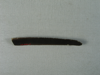  <em>Slender Dark Brown Flint with Two Worked Edges</em>, ca. 1352-1332 B.C.E. Flint, 3 1/4 × 1/2 × 1/4 in. (8.3 × 1.3 × 0.7 cm). Brooklyn Museum, Gift of the Egypt Exploration Society, 25.886.15. Creative Commons-BY (Photo: , CUR.25.886.15_view01.jpg)