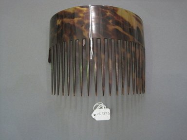  <em>Comb</em>. Tortise shell, 4 3/4 x 6 1/4 in. (12.1 x 15.9 cm). Brooklyn Museum, Gift of Mrs. E. C. Philip, 25.937.3. Creative Commons-BY (Photo: Brooklyn Museum, CUR.25.937.3.jpg)