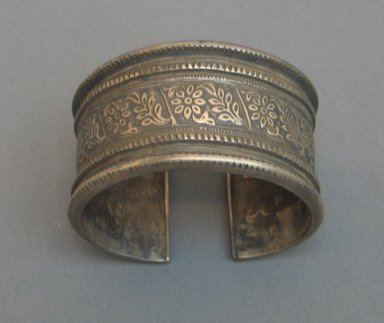  <em>Bracelet, One of a Pair</em>. Silver, 2 5/16 x 2 11/16 x 1 7/16 in. (5.8 x 6.8 x 3.6 cm). Brooklyn Museum, 25602. Creative Commons-BY (Photo: Brooklyn Museum, CUR.25602_top.jpg)
