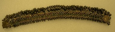  <em>Anklet, One of a Pair</em>. silver links with tiny bells, L. overall 10 in; W. silver links 3/4 in; W. including bells 1 3/8 in. Brooklyn Museum, 25608. Creative Commons-BY (Photo: Brooklyn Museum, CUR.25608.jpg)