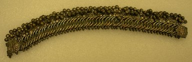  <em>Anklet, One of a Pair</em>. silver links with tiny bells, L. overall 10 in; W. of silver links 7/8 in; W including bells 1 1/4 in. Brooklyn Museum, 25609. Creative Commons-BY (Photo: Brooklyn Museum, CUR.25609.jpg)