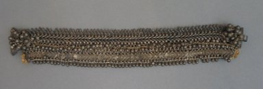  <em>Anklet, One of a Pair</em>. Metal, 1 15/16 x 11 in. (5 x 28 cm). Brooklyn Museum, 25610. Creative Commons-BY (Photo: Brooklyn Museum, CUR.25610_front.jpg)
