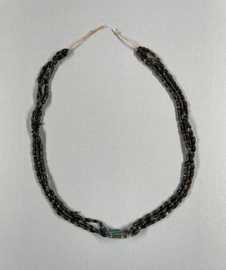  <em>Three Strand Necklace with Scarab</em>, ca. 1630-1539 B.C.E. Steatite, glaze, Scarab: 1/4 × 1/2 × 5/8 in. (0.7 × 1.2 × 1.6 cm). Brooklyn Museum, Gift of the Egypt Exploration Society, 26.162. Creative Commons-BY (Photo: Brooklyn Museum, CUR.26.162_view01.jpg)