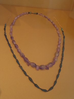  <em>Necklace</em>, ca. 1938-1759 B.C.E. Amethyst, stone, faience, 24 in. (61 cm). Brooklyn Museum, Gift of the Egypt Exploration Society
, 26.46. Creative Commons-BY (Photo: , CUR.26.46_26.159_erg2.jpg)