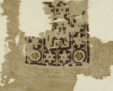 Coptic. <em>Square Fragment with Figure, Geometric, and Potted Plant Decoration</em>, 5th-6th century C.E. Flax, wool, 22 1/2 x 19 1/4 in. (57.2 x 48.9 cm). Brooklyn Museum, Gift of the Long Island Historical Society, 26.741. Creative Commons-BY (Photo: Brooklyn Museum (in collaboration with Index of Christian Art, Princeton University), CUR.26.741_ICA.jpg)