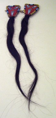 or Blackfoot. <em>Hair Extensions</em>, late 19th-early 20th century. Human hair, cotton, beads, each approx. 21 x 2 3/4 in. or (40.0 x 5.0 cm). Brooklyn Museum, 26.758. Creative Commons-BY (Photo: Brooklyn Museum, CUR.26.758a-b_view1.jpg)