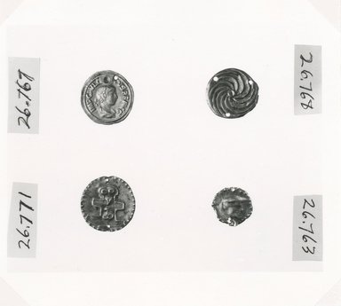 Roman ?. <em>Disk</em>, 3rd century C.E. Gold, 3/4 in. (1.9 cm). Brooklyn Museum, Gift of George D. Pratt, 26.768. Creative Commons-BY (Photo: , CUR.26.767_26.771_26.768_26.763_NegID_26.767_GRPA_print_bw.jpg)