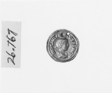 Roman. <em>Thin Disk</em>, 3rd century C.E. Gold, Diam. 13/16 in. (2 cm). Brooklyn Museum, Gift of George D. Pratt, 26.767. Creative Commons-BY (Photo: Brooklyn Museum, CUR.26.767_NegID_26.767_GRPA_print_cropped_bw.jpg)