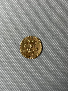 Cypriot. <em>Small Disk</em>, 1st century B.C.E. Gold, 13/16 × 13/16 in. (2.1 × 2.1 cm). Brooklyn Museum, Gift of George D. Pratt, 26.771. Creative Commons-BY (Photo: Brooklyn Museum, CUR.26.771_overall.JPG)