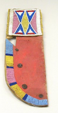 Lakota Knife Sheath with X-forms (belonging to Red Cloud), late 19th century. Rawhide, pigment, beads, nails. 
