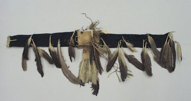Lakota, Sioux. <em>Feathered Bonnet Trailer</em>, late 19th-early 20th century. Wool cloth, eagle feathers, rawhide, dyed horsehair, tin cones, porcupine quill, 72 13/16 x 20 1/2 in.  (185 x 52 cm). Brooklyn Museum, Robert B. Woodward Memorial Fund, 26.803.1. Creative Commons-BY (Photo: Brooklyn Museum, CUR.26.803_view1.jpg)