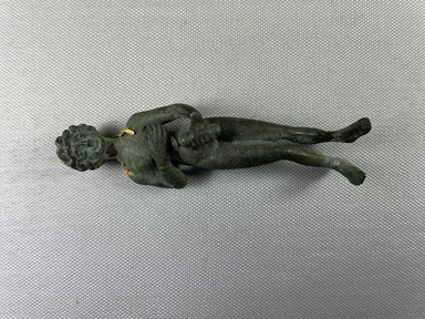 Roman. <em>Statuette of Aphrodite</em>, 2nd century C.E., probably. Bronze, gold, 4 1/2 × 1 3/8 × 1 in. (11.5 × 3.5 × 2.6 cm). Brooklyn Museum, Gift of George D. Pratt, 26.814. Creative Commons-BY (Photo: Brooklyn Museum, CUR.26.814_view01.jpg)