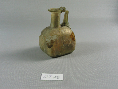 Roman. <em>Jug</em>, 1st-early 8th century C.E. Glass, 2 13/16 x 1 13/16 x 1 15/16 in. (7.2 x 4.6 x 4.9 cm). Brooklyn Museum, Anonymous gift, 27.728. Creative Commons-BY (Photo: Brooklyn Museum, CUR.27.728_side_left.jpg)