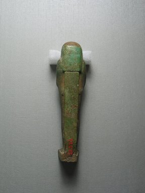  <em>Ushabti</em>, 664-332 B.C.E. Faience, 6 5/16 x 1 1/2 x 1 5/16 in. (16 x 3.8 x 3.3 cm). Brooklyn Museum, Gift of the Long Island Historical Society, 28.525. Creative Commons-BY (Photo: Brooklyn Museum, CUR.28.525_view4.jpg)