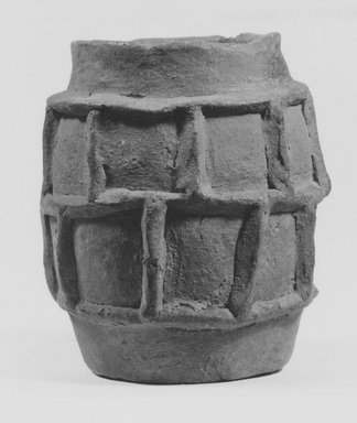 Latial. <em>Barrel-Shaped Vase</em>, ca. 900 B.C.E.–700 B.C.E. Clay, 4 11/16 × Diam. 4 3/16 in. (11.9 × 10.6 cm). Brooklyn Museum, Gift of the Long Island Historical Society, 28.765. Creative Commons-BY (Photo: Brooklyn Museum, CUR.28.765_NegA_print_bw.jpg)