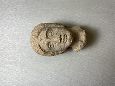 Roman. <em>Head of Woman</em>, 1st century B.C.E., probably. Clay, 4 1/8 × 2 13/16 × 2 1/2 in. (10.4 × 7.1 × 6.4 cm). Brooklyn Museum, Gift of the Long Island Historical Society, 28.766. Creative Commons-BY (Photo: Brooklyn Museum, CUR.28.766_view01.jpg)